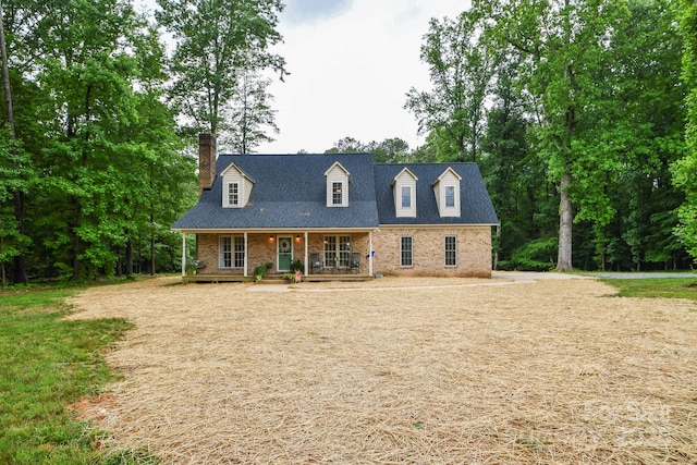 15025 Barbee Rd, Stanfield, NC 28163 - cape cod-style house featuring covered porch, brick siding, and a chimney