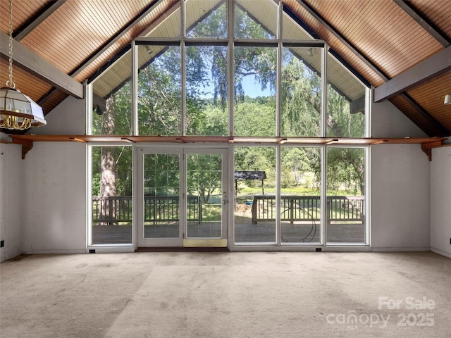 272 Pinners Cove Rd, Asheville, NC 28803 - unfurnished living room with high vaulted ceiling, carpet flooring, a chandelier, and wood ceiling with exposed beams