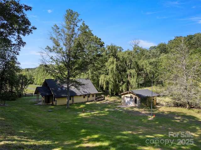 272 Pinners Cove Rd, Asheville, NC 28803 - view of grassy yard with a view of trees and an outdoor structure