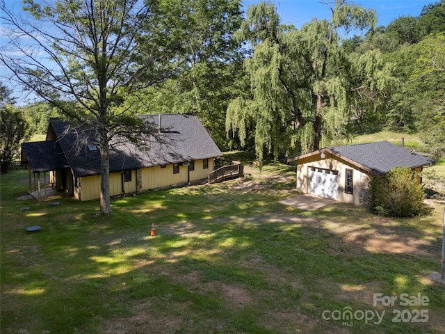 272 Pinners Cove Rd, Asheville, NC 28803 - view of grassy yard with a wooden deck and an outbuilding