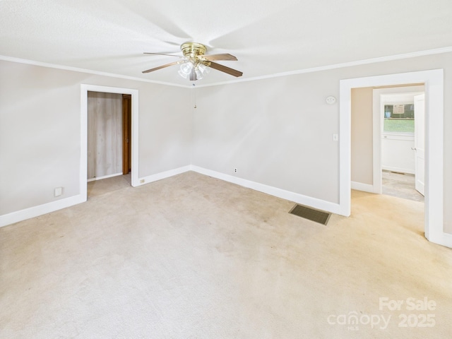 271 NC-16 Hwy N, Taylorsville, NC 28681 - empty room with ornamental molding, ceiling fan, baseboards, and light carpet