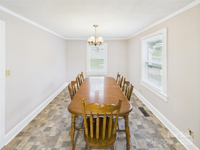271 NC-16 Hwy N, Taylorsville, NC 28681 - dining area featuring a chandelier, crown molding, baseboards, stone finish floors, and a textured ceiling