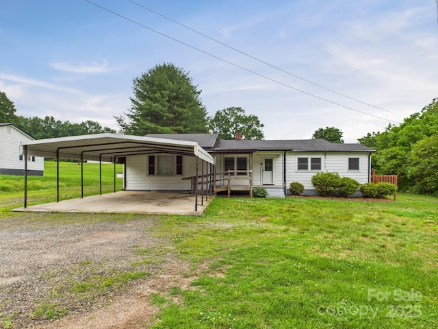 271 NC-16 Hwy N, Taylorsville, NC 28681 - single story home with dirt driveway, covered porch, a front lawn, and a carport