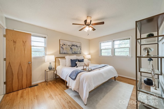 1188 Rainbow Cir, Catawba, SC 29704 - bedroom featuring multiple windows, baseboards, and light wood finished floors