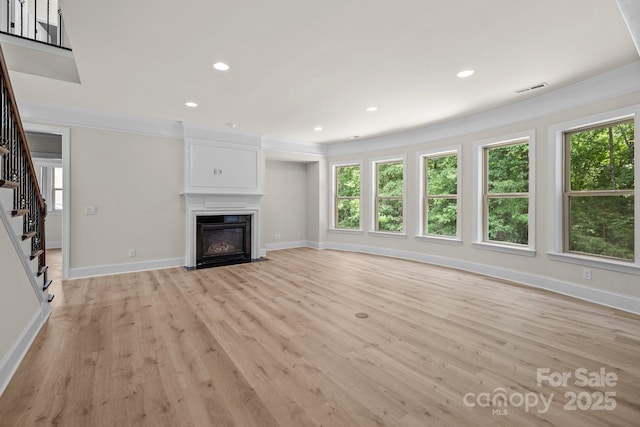 10508 Kristens Mare Dr, Charlotte, NC 28277 - unfurnished living room featuring healthy amount of natural light, stairs, ornamental molding, baseboards, and recessed lighting