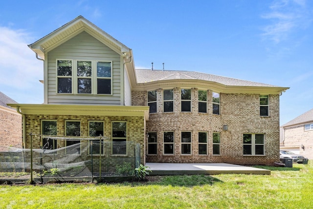 10508 Kristens Mare Dr, Charlotte, NC 28277 - rear view of house with a yard, brick siding, and a patio area