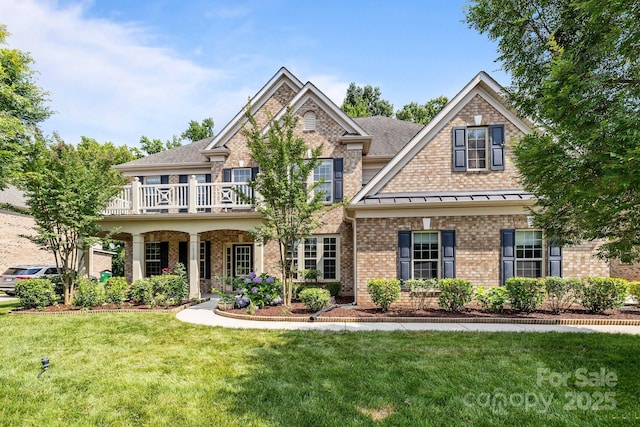 10508 Kristens Mare Dr, Charlotte, NC 28277 - view of front facade featuring brick siding, a front yard, a shingled roof, and a standing seam roof