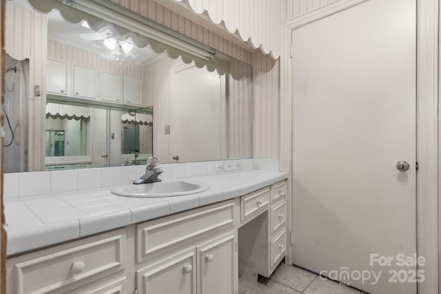 4002 Hickory Blvd, Granite Falls, NC 28630 - bathroom featuring wallpapered walls, vanity, tile patterned flooring, and crown molding