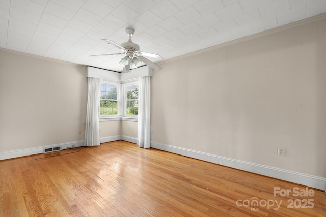 4002 Hickory Blvd, Granite Falls, NC 28630 - spare room featuring crown molding, a ceiling fan, and wood finished floors