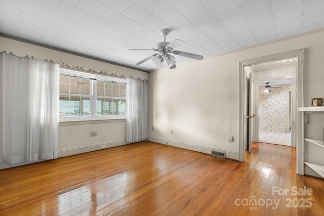 4002 Hickory Blvd, Granite Falls, NC 28630 - spare room with wood finished floors, a ceiling fan, and ornamental molding