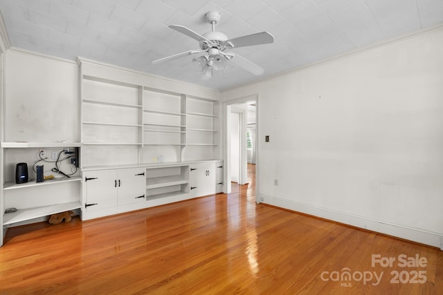 4002 Hickory Blvd, Granite Falls, NC 28630 - interior space with crown molding, a ceiling fan, wood finished floors, and built in features