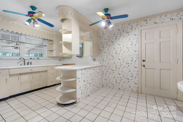 4002 Hickory Blvd, Granite Falls, NC 28630 - kitchen with open shelves, ceiling fan, light countertops, wallpapered walls, and light tile patterned flooring