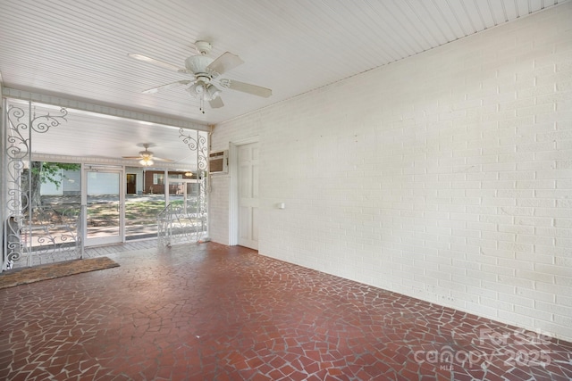 4002 Hickory Blvd, Granite Falls, NC 28630 - empty room featuring a ceiling fan and brick wall