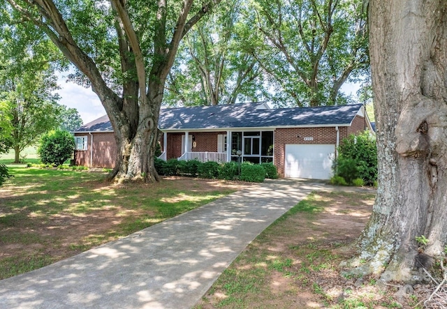 4002 Hickory Blvd, Granite Falls, NC 28630 - single story home with brick siding, covered porch, a garage, and concrete driveway