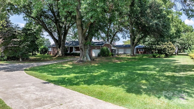4002 Hickory Blvd, Granite Falls, NC 28630 - single story home featuring driveway, a front yard, and an attached garage