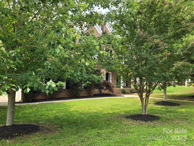 8409 Olde Stonegate Ln, Mint Hill, NC 28227 - view of front of home featuring a front yard and brick siding