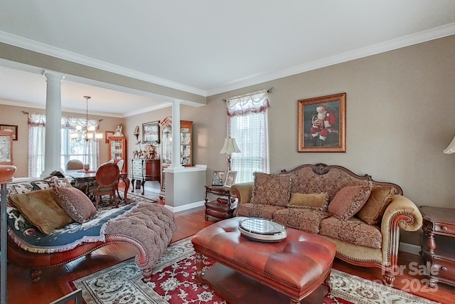 8409 Olde Stonegate Ln, Mint Hill, NC 28227 - living area featuring ornate columns, a chandelier, healthy amount of natural light, and crown molding