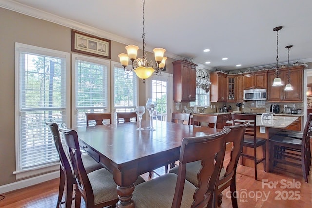 8409 Olde Stonegate Ln, Mint Hill, NC 28227 - dining room featuring ornamental molding, a chandelier, light wood finished floors, and recessed lighting