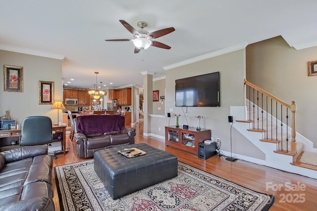 8409 Olde Stonegate Ln, Mint Hill, NC 28227 - living area with light wood-type flooring, ceiling fan, stairway, ornamental molding, and recessed lighting