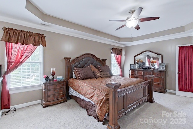 8409 Olde Stonegate Ln, Mint Hill, NC 28227 - bedroom featuring a raised ceiling, light colored carpet, baseboards, and ceiling fan