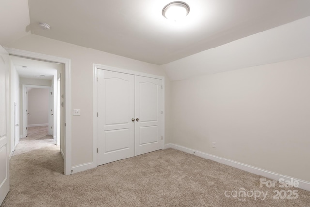 679 Cape Fear St, Fort Mill, SC 29715 - unfurnished bedroom featuring carpet flooring, a closet, and lofted ceiling