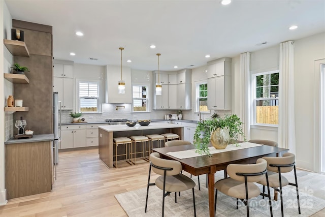 1834 Arnold Dr, Charlotte, NC 28205 - dining area with light wood-type flooring, plenty of natural light, and recessed lighting
