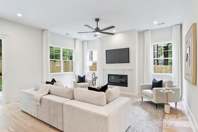 1834 Arnold Dr, Charlotte, NC 28205 - living room with healthy amount of natural light, a premium fireplace, baseboards, ceiling fan, and recessed lighting