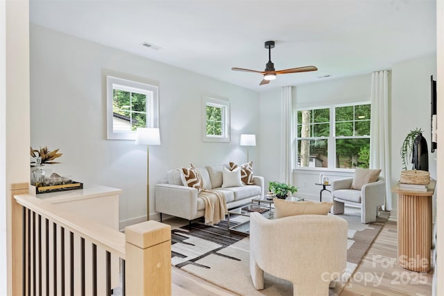 1834 Arnold Dr, Charlotte, NC 28205 - living room featuring healthy amount of natural light, light wood-style floors, and a ceiling fan