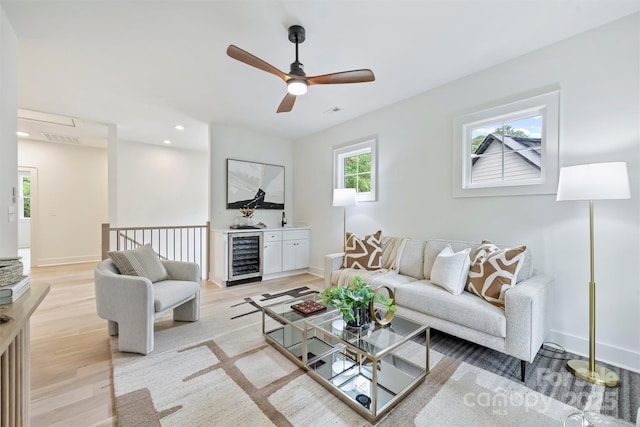 1834 Arnold Dr, Charlotte, NC 28205 - living area with beverage cooler, light wood finished floors, baseboards, a ceiling fan, and recessed lighting