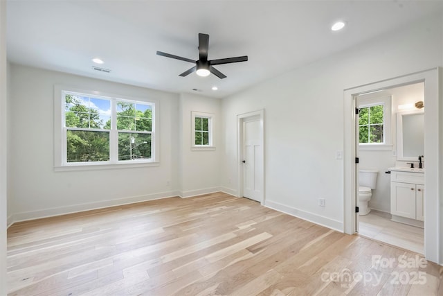 1834 Arnold Dr, Charlotte, NC 28205 - unfurnished bedroom featuring light wood-type flooring, ensuite bath, baseboards, recessed lighting, and a ceiling fan