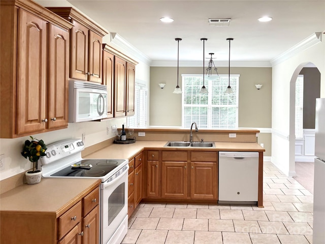 12904 Windy Lea Ln, Huntersville, NC 28078 - kitchen with white appliances, a sink, a peninsula, arched walkways, and crown molding