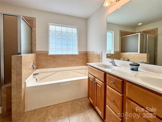 12904 Windy Lea Ln, Huntersville, NC 28078 - full bathroom featuring tile patterned flooring, a garden tub, double vanity, and a stall shower