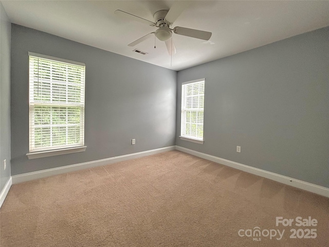 12904 Windy Lea Ln, Huntersville, NC 28078 - empty room featuring baseboards, light carpet, and a ceiling fan