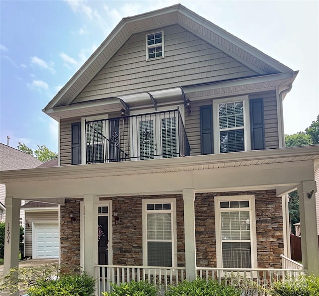 12904 Windy Lea Ln, Huntersville, NC 28078 - view of front of property with covered porch, stone siding, and a balcony
