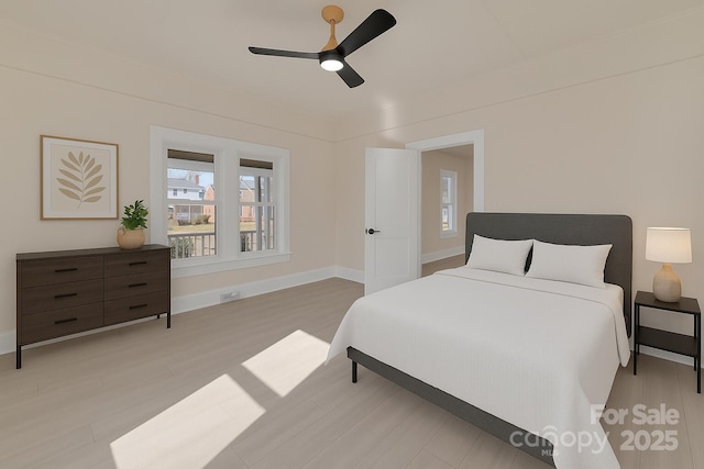 1003 S Ridge Ave, Kannapolis, NC 28083 - bedroom with multiple windows, light wood-style flooring, ceiling fan, and baseboards