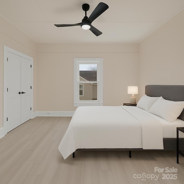 1003 S Ridge Ave, Kannapolis, NC 28083 - bedroom featuring light wood-style flooring, a ceiling fan, and baseboards
