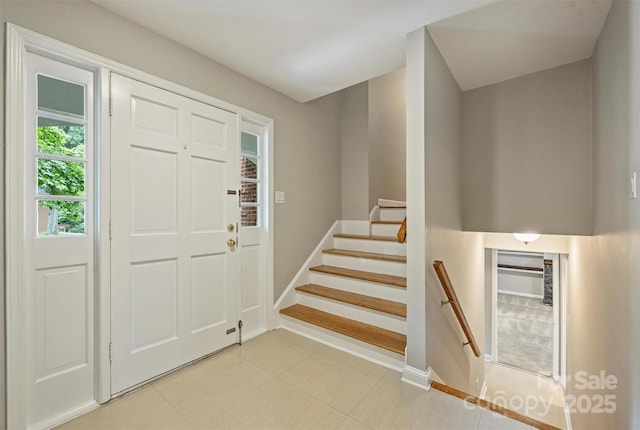 2301 Seth Thomas Rd, Charlotte, NC 28210 - entrance foyer with light tile patterned floors, baseboards, and stairs