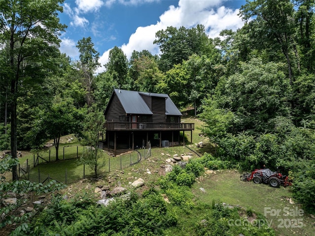 309 Doubleview Dr, Union Mills, NC 28167 - rear view of property featuring a wooden deck, a metal roof, and a forest view