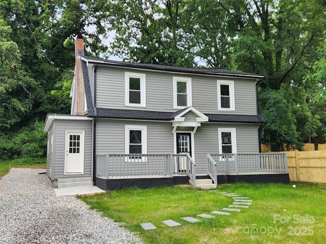 1434 N Hamilton St, High Point, NC 27262 - view of front of house featuring a deck, a chimney, and a shingled roof