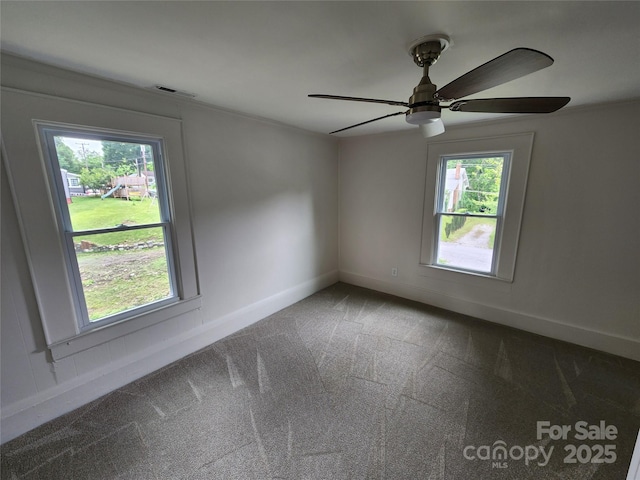 1434 N Hamilton St, High Point, NC 27262 - spare room with carpet flooring, plenty of natural light, a ceiling fan, and baseboards