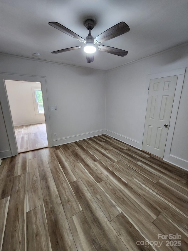 1434 N Hamilton St, High Point, NC 27262 - spare room featuring wood finished floors, ceiling fan, and baseboards