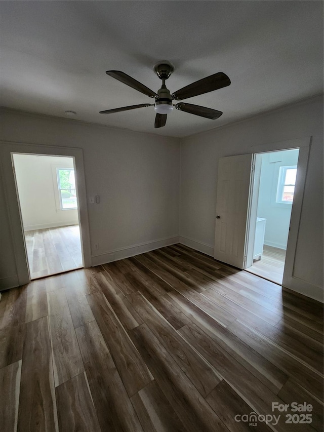 1434 N Hamilton St, High Point, NC 27262 - unfurnished room with plenty of natural light, a ceiling fan, wood finished floors, and baseboards