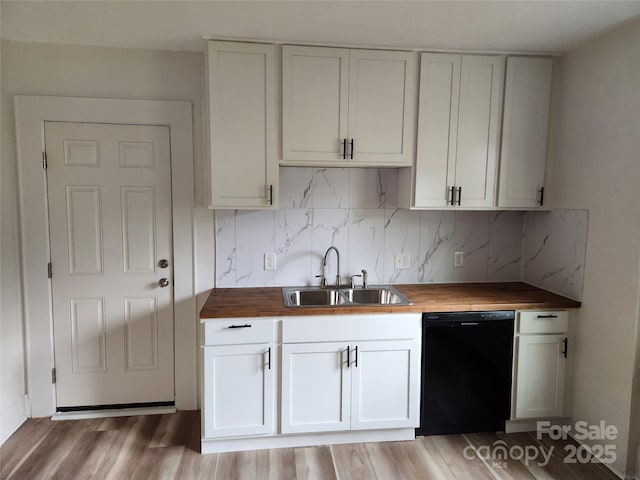1434 N Hamilton St, High Point, NC 27262 - kitchen featuring black dishwasher, butcher block counters, a sink, and decorative backsplash