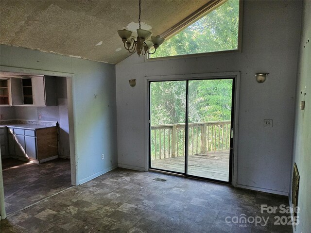 211 Putnam St, Shelby, NC 28152 - unfurnished dining area with lofted ceiling and a chandelier