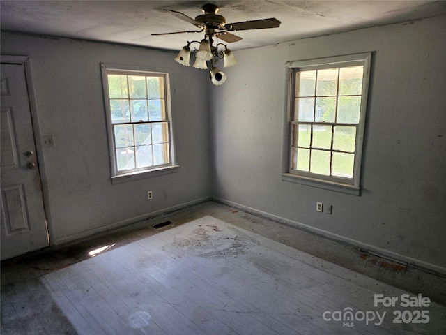 211 Putnam St, Shelby, NC 28152 - spare room featuring a ceiling fan and wood finished floors