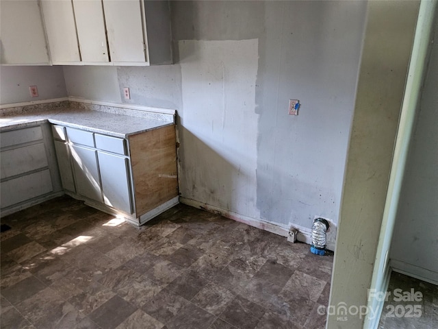 211 Putnam St, Shelby, NC 28152 - kitchen featuring light countertops and white cabinets