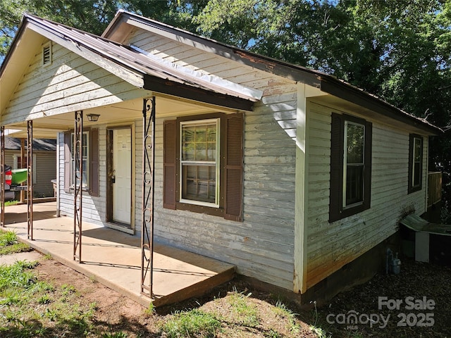 211 Putnam St, Shelby, NC 28152 - view of side of home featuring a porch
