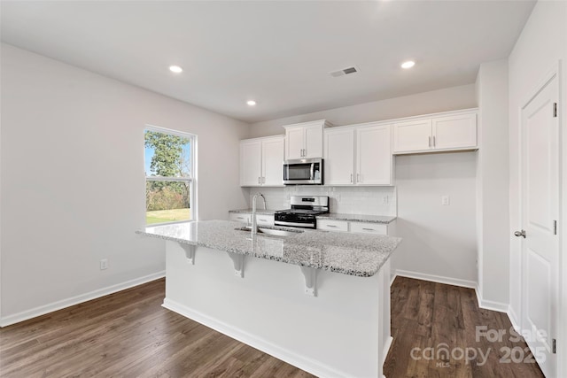 50 Lance Forest Rd, Fletcher, NC 28732 - kitchen featuring stainless steel appliances, a center island with sink, white cabinetry, a sink, and decorative backsplash