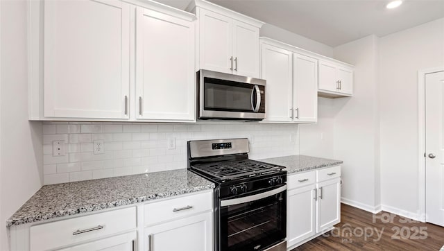 50 Lance Forest Rd, Fletcher, NC 28732 - kitchen featuring appliances with stainless steel finishes, white cabinets, light stone counters, baseboards, and recessed lighting