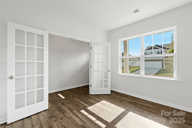 50 Lance Forest Rd, Fletcher, NC 28732 - unfurnished room featuring french doors, baseboards, and wood finished floors